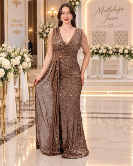 Woman in a bronze sequin evening gown posing in an ornate wedding venue with white flowers and gold decor.